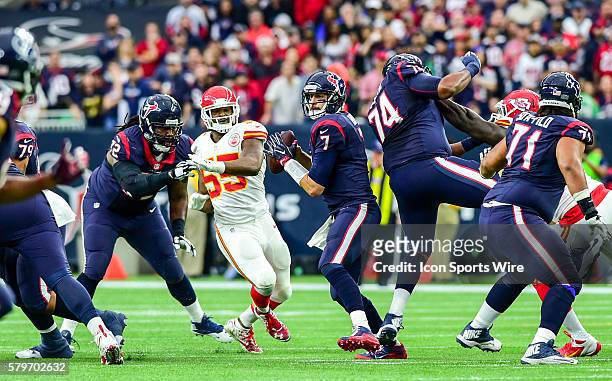 The pocket collapses on Houston Texans quarterback Brian Hoyer just before he fumbles and the Chiefs recover in first half action during the Chiefs...