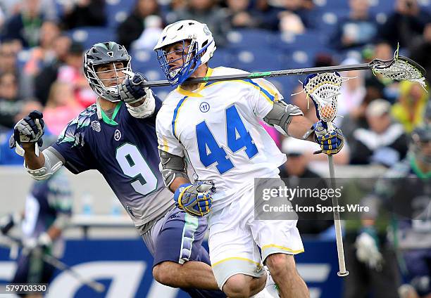 Chesapeake Bayhawks defender CJ Costabile in action against Florida Launch midfielder Steven Brooks during an MLL lacrosse match between the Florida...