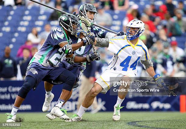 Chesapeake Bayhawks midfielder Mark McNeill , and Chesapeake Bayhawks defender CJ Costabile in action against Florida Launch midfielder Steven Brooks...