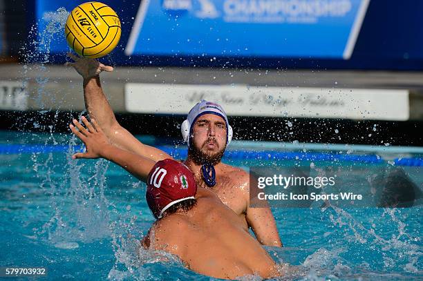 Stanford Cardinal driver Smith, Cody tries to knockdown the shot during the NCAA Mens Water Polo Semi-final game between the USC Trojans and the...