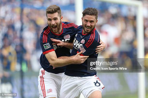 New England's Chris Tierney celebrates his goal with Patrick Mullins . The Los Angeles Galaxy played the New England Revolution in Carson, California...