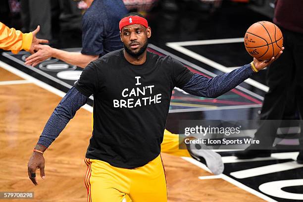 Cleveland Cavaliers forward LeBron James wears a t shirt to honor Eric Garner during warmups before a NBA game between the Cleveland Cavaliers and...