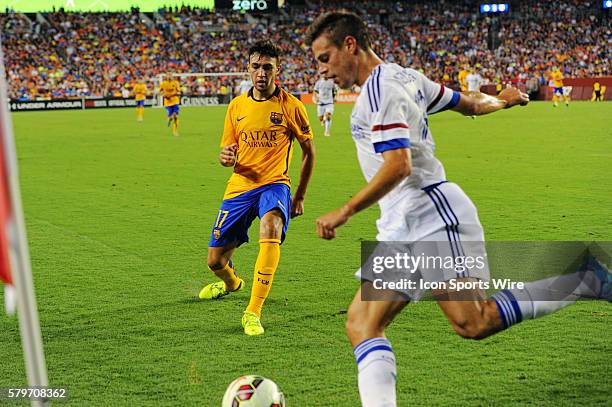 Chelsea defender Cesar Azpilicueta handles the ball against Barcelona forward Munir El Haddadi at FedEx Field in Landover, Md. In the first half...