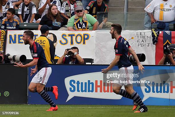 New England Revolution's Chris Tierney and New England Revolution's Patrick Mullins celebrate the tying goal. The Los Angeles Galaxy defeated the New...