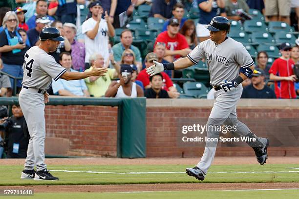 New York Yankees Right field Carlos Beltran [1430] shakes hands with Third Base Coach Joe Espada after hitting a second inning home run during the...