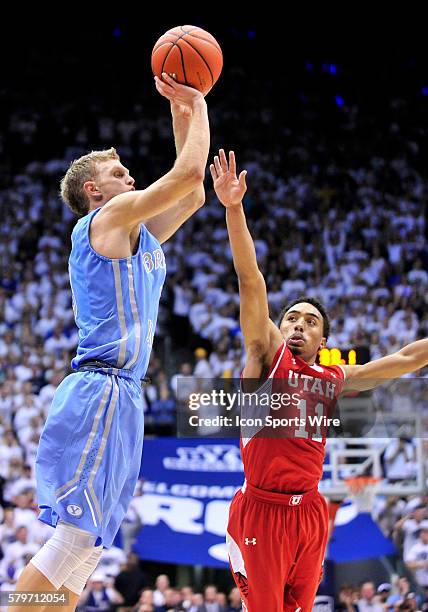 Brigham Young Cougars guard Tyler Haws puts up a three point shot late in the game that could tie the game but missed as Utah Utes guard Brandon...