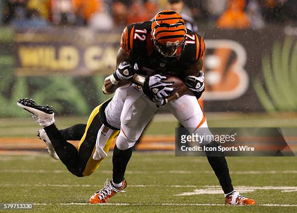Cincinnati Bengals wider receiver Mohamed Sanu fights to break free from Pittsburgh Steelers' Brandon Boykin during the first half of play in their...