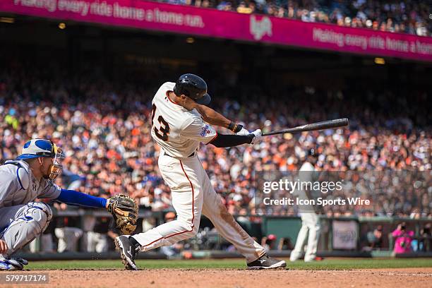 San Francisco Giants right fielder Justin Maxwell at bat and connecting to knock him the winning run, in the 10th inning during a Major League...