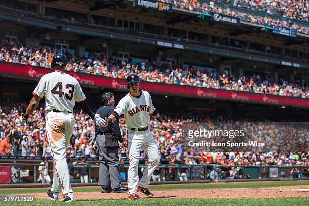 San Francisco Giants second baseman Joe Panik celebrates scoring wing San Francisco Giants right fielder Justin Maxwell , in the 6th inning during a...