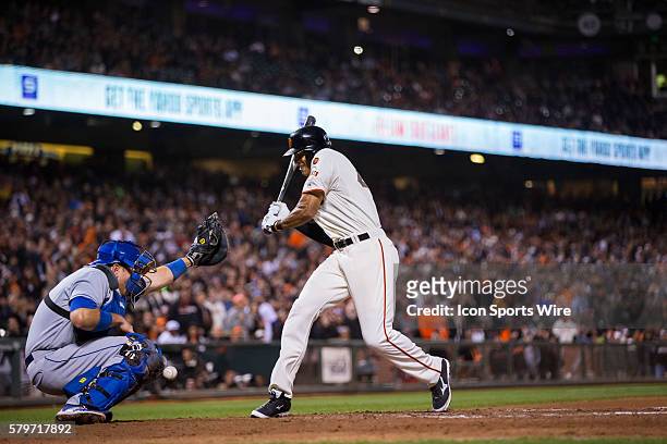 San Francisco Giants right fielder Justin Maxwell is hit by the ball, which also injured Los Angeles Dodgers catcher A.J. Ellis , who had to leave...