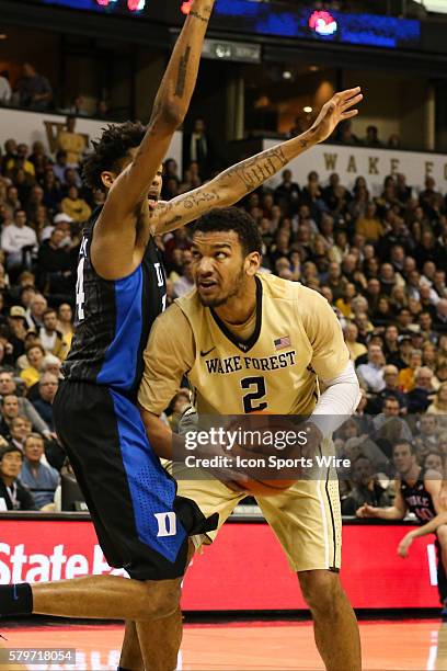 Wake Forest Demon Deacons forward Devin Thomas tries to get inside on Duke Blue Devils guard Brandon Ingram during the regular season matchup between...