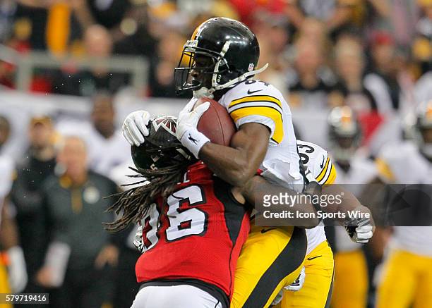Pittsburgh Steelers wide receiver Antonio Brown is hit hard by Atlanta Falcons strong safety Kemal Ishmael in first half action of the Pittsburgh...