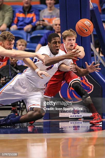 Boise State Broncos center Kevin Allen and Southern Utah Thunderbirds guard A.J. Hess go after a loose ball during 2nd half action between Southern...
