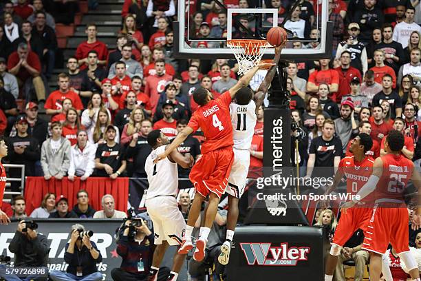 Cincinnati Bearcats forward Gary Clark takes a shot over defender Houston Cougars guard LeRon Barnes during the game against The Cincinnati Bearcats...