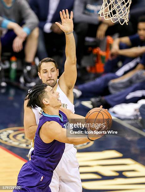 Charlotte Hornets guard Jeremy Lin shoots against New Orleans Pelicans forward Ryan Anderson during the NBA game between the Charlotte Hornets and...