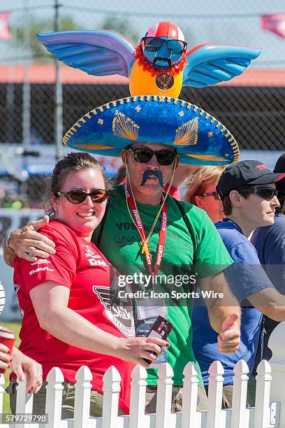 Festive fans take in the festivities in the winners circle following the Honda Indy 200 at Mid-Ohio at the Mid-Ohio Sports Car Course in Lexington,...