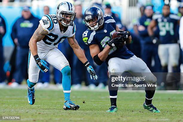 Carolina Panthers free safety Kurt Coleman closes in on Seattle Seahawks wide receiver Doug Baldwin during the NFC Divisional Playoff game between...