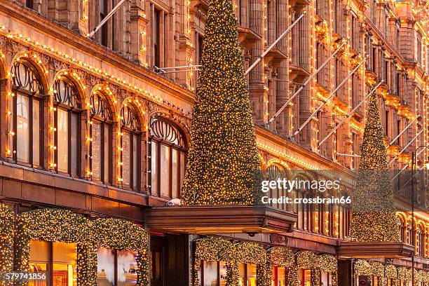 london, harrods stores facade with christmas time - london at christmas stock pictures, royalty-free photos & images