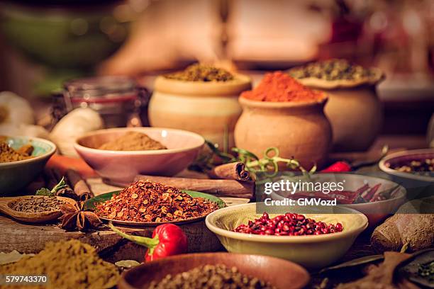 spices and herbs on wooden background - cooking chili stock pictures, royalty-free photos & images