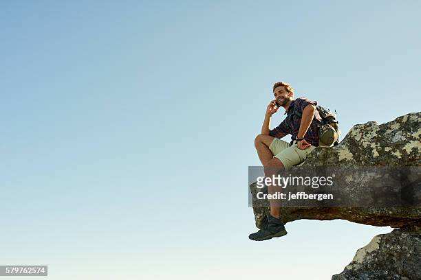 i made it to the top! - outdoor guy sitting on a rock stock pictures, royalty-free photos & images
