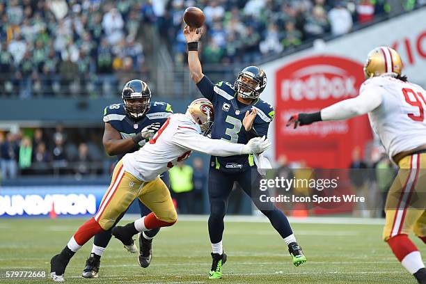 Seattle Seahawks Quarterback Russell Wilson [17722] battles with San Francisco 49ers Linebacker Aldon Smith [17117] in action during a game between...