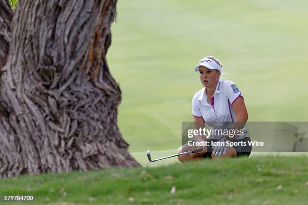 Brooke M. Henderson of Canada looks under a tree on to line up her 3rd shot during the second round of the Volunteers of America North Texas Shootout...