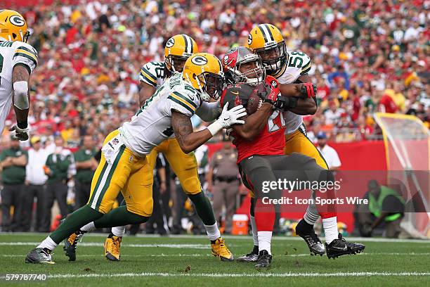 Tampa Bay Buccaneers running back Doug Martin is stopped for no gain by Green Bay Packers inside linebacker Sam Barrington , Green Bay Packers free...