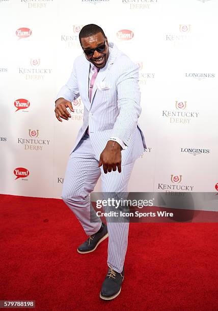 Player Chris Canty of the Baltimore Ravens arrives on the red carpet at the 141st running of the Kentucky Derby at Churchill Downs in Louisville, KY.