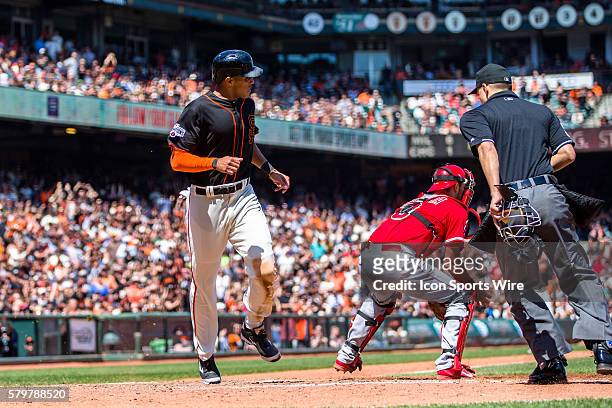 San Francisco Giants right fielder Justin Maxwell scores off a one-run single by San Francisco Giants third baseman Casey McGehee in the 5th inning,...