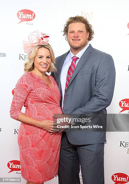 Football player Eric Wood of the Buffalo Bills, with his wife, Leslie, arrives on the red carpet at the 141st running of the Kentucky Derby at...