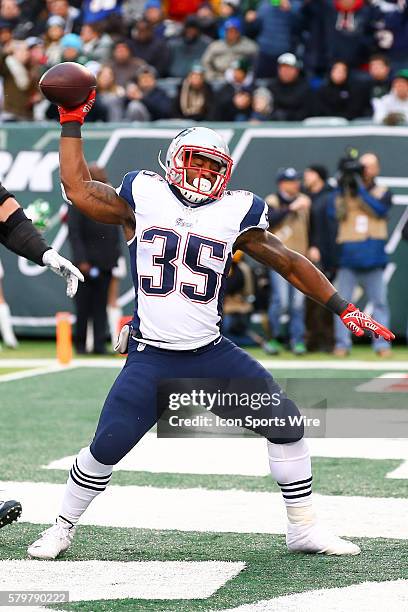 New England Patriots running back Jonas Gray spikes the football after scoring a touchdown during the fourth quarter of the game between the New York...