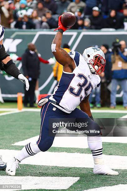 New England Patriots running back Jonas Gray spikes the football after scoring a touchdown during the fourth quarter of the game between the New York...