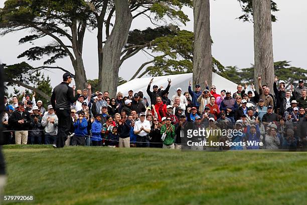 The crowd cheers Rory McIlroy after sinking the winning putt against Jim Furyk in the semi final of the World Golf Championships at Harding Park in...