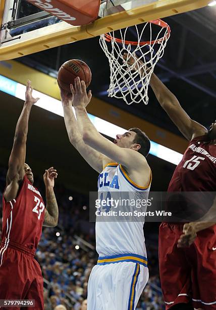 Bruins Gy??rgy Golom??n goes up for a layup takes a shot over Washington State Cougars Junior Longrus during the game at Pauley Pavilion in Westwood,...