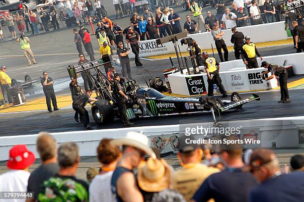 The crew for Brittany Force checks her car prior to the qualifying session at the NHRA Sonoma Nationals in Sonoma, CA.