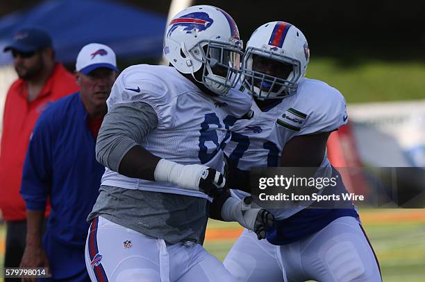 Buffalo Bills tackle Cyrus Kouandjio and Buffalo Bills defensive end BJ Larsen work out during the Buffalo Bills Training Camp at St. John Fisher...