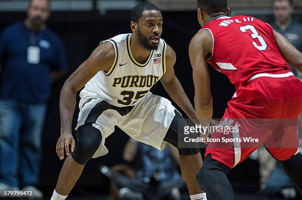 Purdue Boilermakers guard Rapheal Davis defends Nebraska Cornhuskers guard Andrew White III during the NCAA basketball game between the Purdue...