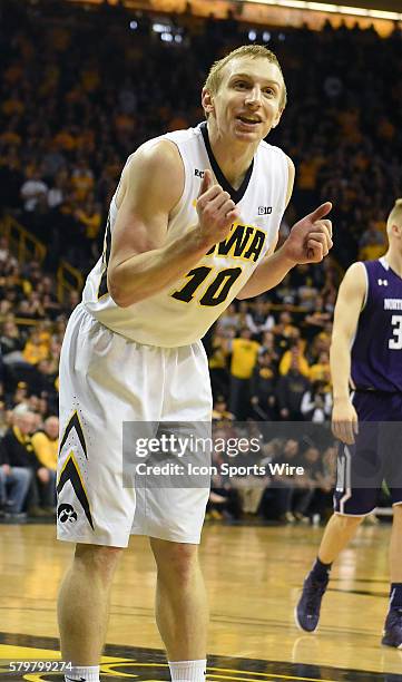 Iowa Hawkeyes guard Mike Gesell pleads his case with a referee after being charged with a foul during a Big Ten Conference mens basketball game...
