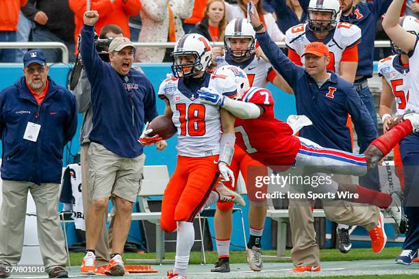 Illinois Fighting Illini wide receiver Mike Dudek is brought down by Louisiana Tech Bulldogs defensive back Xavier Woods after a long gain during the...