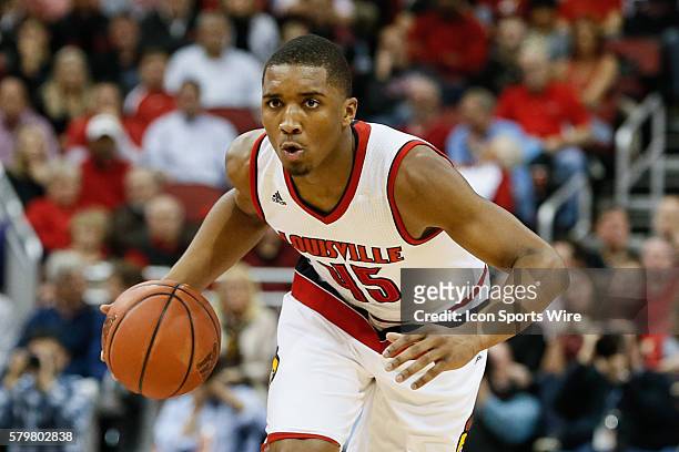 Louisville Cardinals guard Donovan Mitchell controls the ball during the game against The Louisville Cardinals and North Carolina Tar Heels at The...