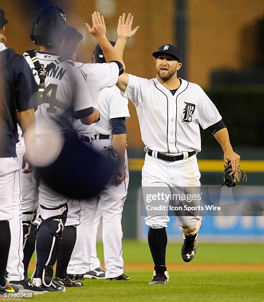 Detroit Tigers Outfield Tyler Collins [8940] high fives his teammates after making a running catch on a line drive in the gap off the bat of Kansas...