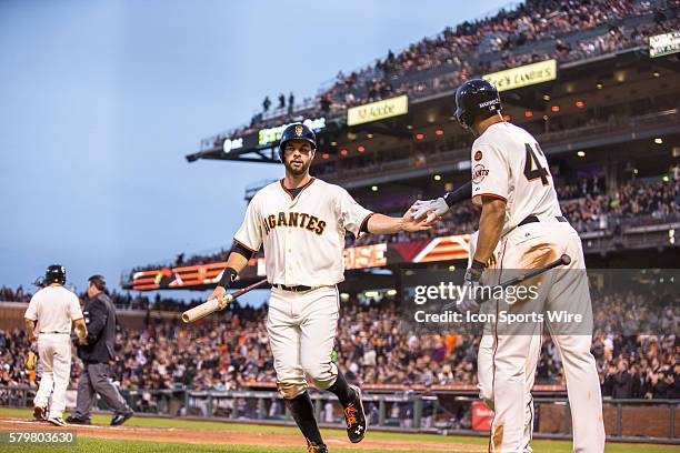 San Francisco Giants first baseman Brandon Belt celebrates scoring with San Francisco Giants right fielder Justin Maxwell , in the 3rd inning during...