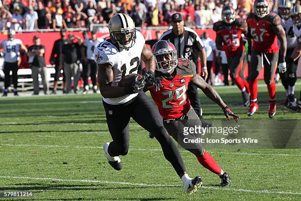 New Orleans Saints wide receiver Marques Colston heads toward the end zone for a touchdown after avoiding being tackled by Tampa Bay Buccaneers...