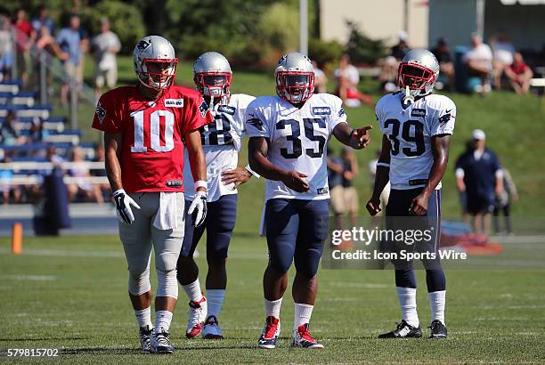 New England Patriots quarterback Jimmy Garoppolo waits with New England Patriots running back Brandon Bolden , New England Patriots running back...