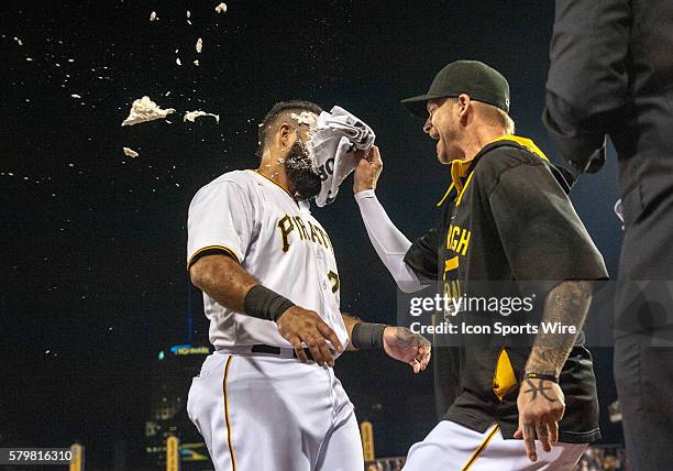 Pittsburgh Pirates first baseman Pedro Alvarez is hit with a whipped cream pie by starting pitcher A.J. Burnett after hitting a walkoff single to...