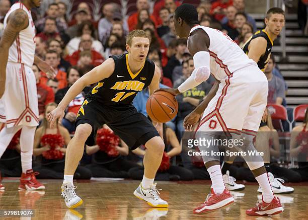 Mike Gesell of the Iowa Hawkeyes guarding Shannon Scott of the Ohio State Buckeyes during the game between the Ohio State Buckeyes and the Iowa...