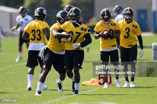 Pittsburgh Steelers safety Gerod Holliman tries to take the ball off Pittsburgh Steelers safety Isaiah Lewis during the 2015 Pittsburgh Steelers...