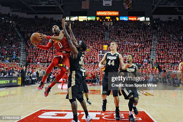 Maryland Terrapins guard Rasheed Sulaimon scores against Purdue Boilermakers guard Rapheal Davis at the Xfinity Center in College Park, MD. Where the...