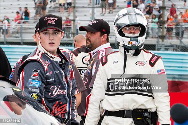 Ty Dillon stands at his Yuengling Light Lager Chevy with a NASCAR Official after a post race altercation with Regan Smith after the NASCAR XFINITY...