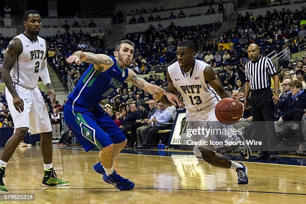 Pittsburgh Panthers Guard Josh Newkirk drives to the hoop while being guarded by Florida Gulf Coast Eagles Guard Brett Comer during the second half...